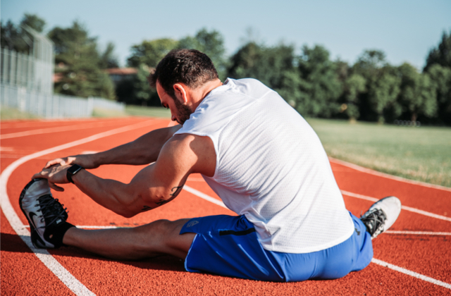 An athlete stretching before a competition